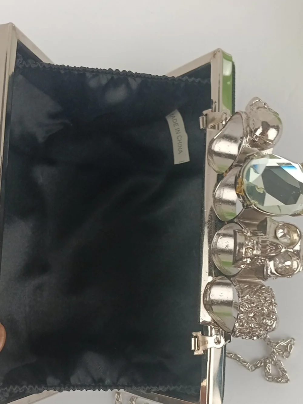 Women’s Black Lace Hard Shell Knuckle Duster Clutch with Silver Skull Detail